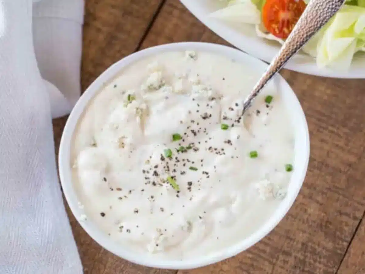 Bowl of dressing with spoon