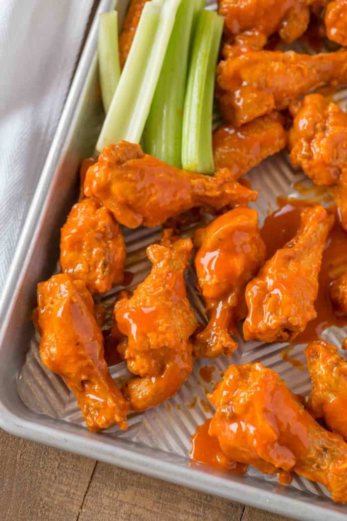 Easy Buffalo Wings on baking sheet with celery