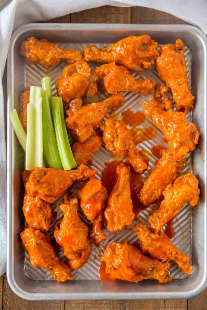 Buffalo Wings on baking sheet with celery