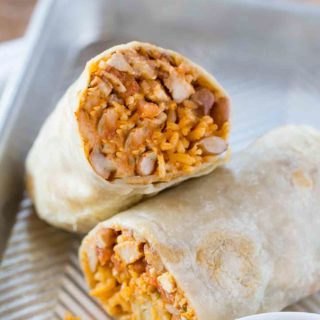 Chicken Burrito cut in half with rice