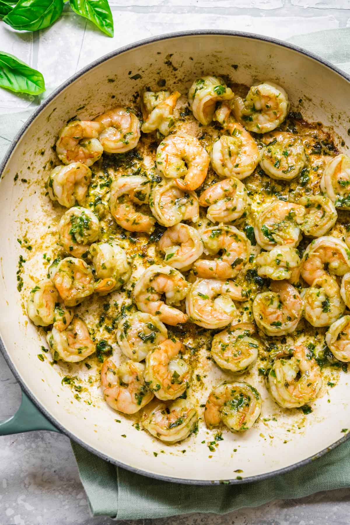 Shrimp Pesto Pasta with Basil Pesto cooked shrimp in skillet