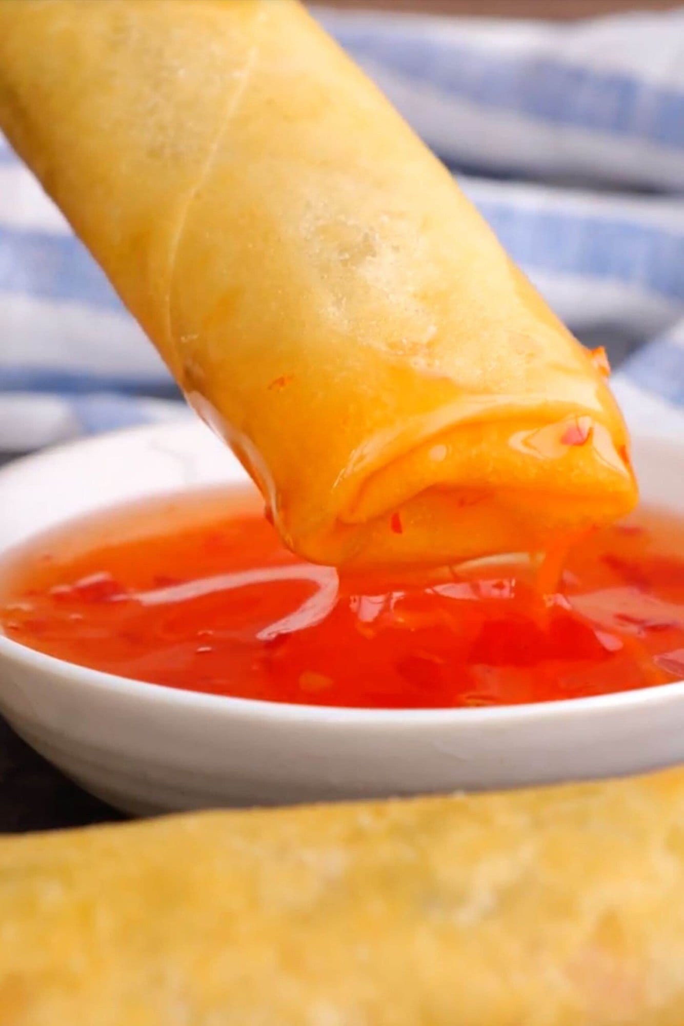 Spring Rolls dipped in dipping sauce