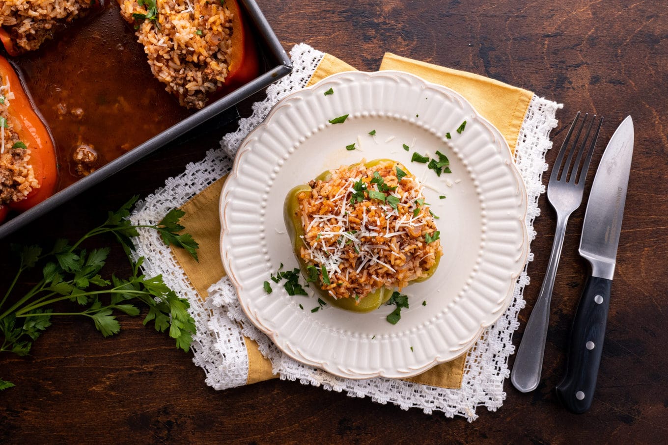 Stuffed Peppers on plate with parmesan & parsley