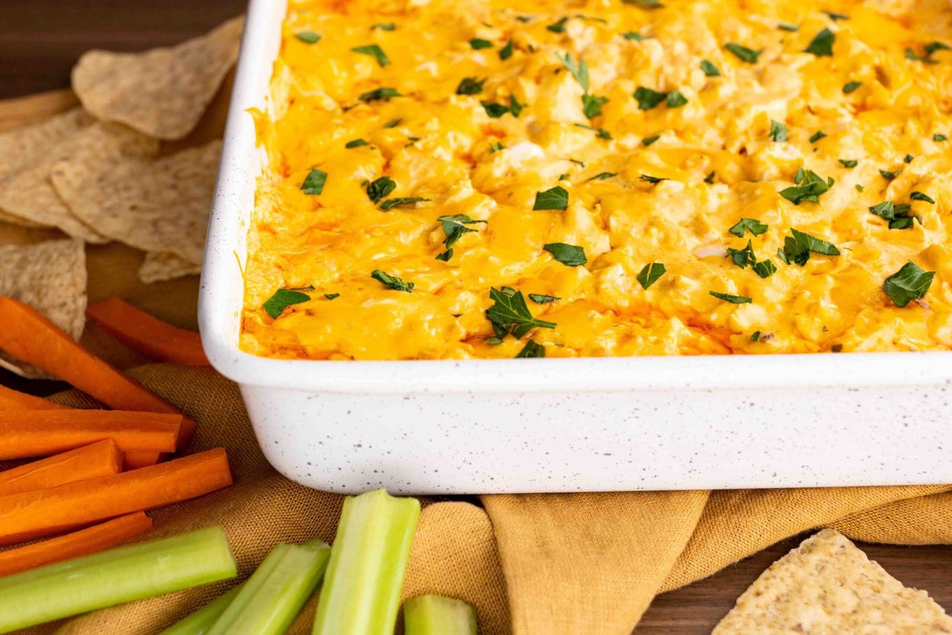 Buffalo Chicken Dip tastes just like buffalo wings dipped in ranch dressing with just five ingredients. No mess and all the flavors you love! Perfect for any holiday or Super Bowl party!
