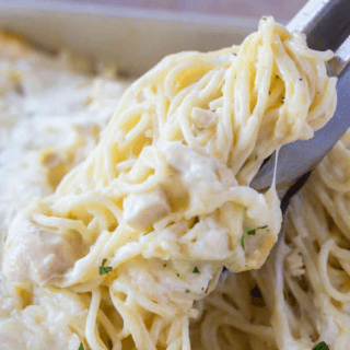 pasta being picked up by tongs