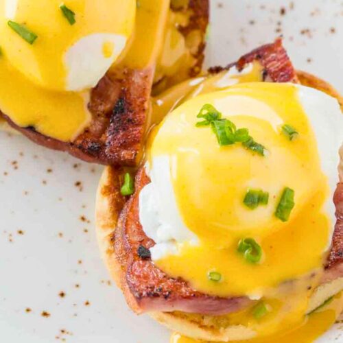 Top down view of Benedict portions assembled on plate.