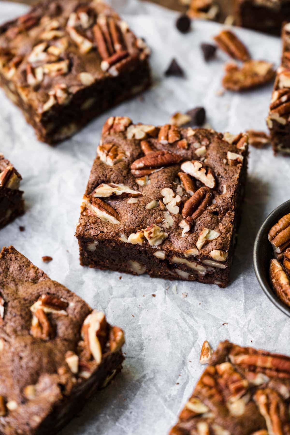 Pecan Brownies squares on parchment