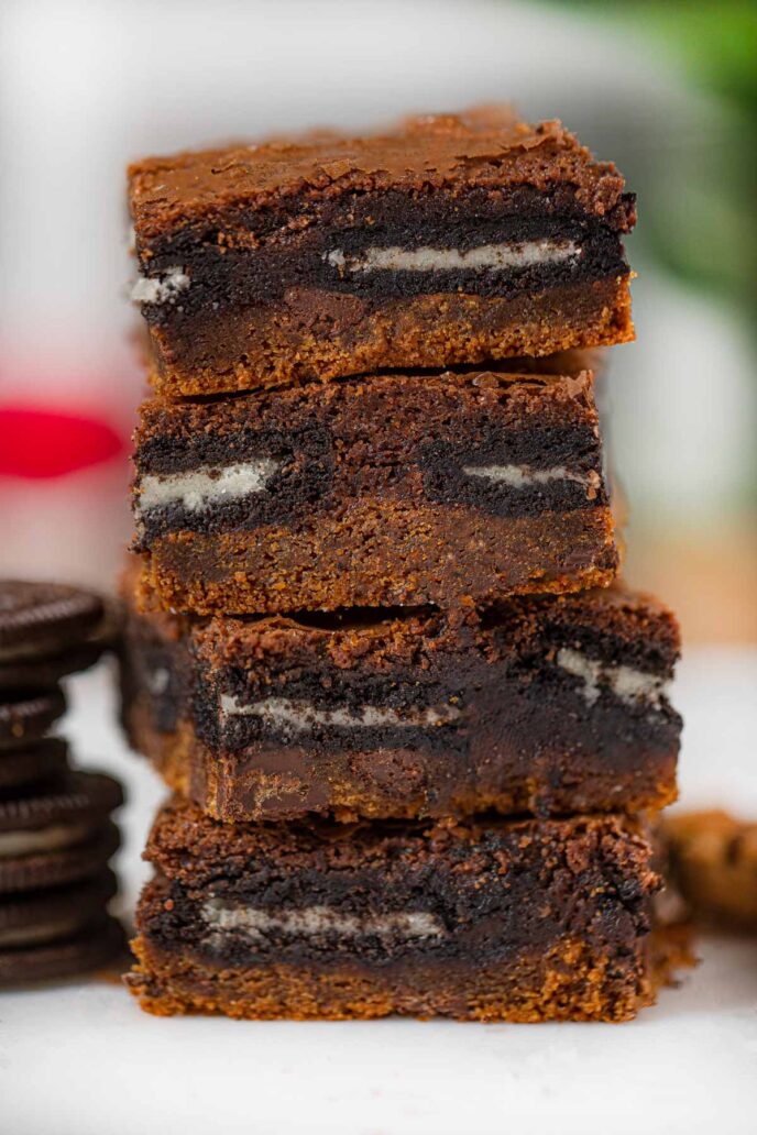 Slutty Brownies with Cookie Dough and Oreos in a stack