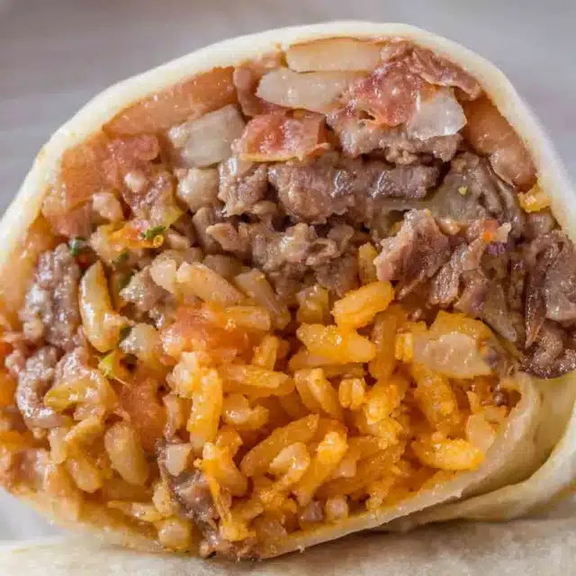 Closeup of ingredients wrapped in a tortilla