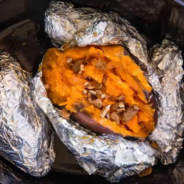 potatoes in slow cooker topped with nuts