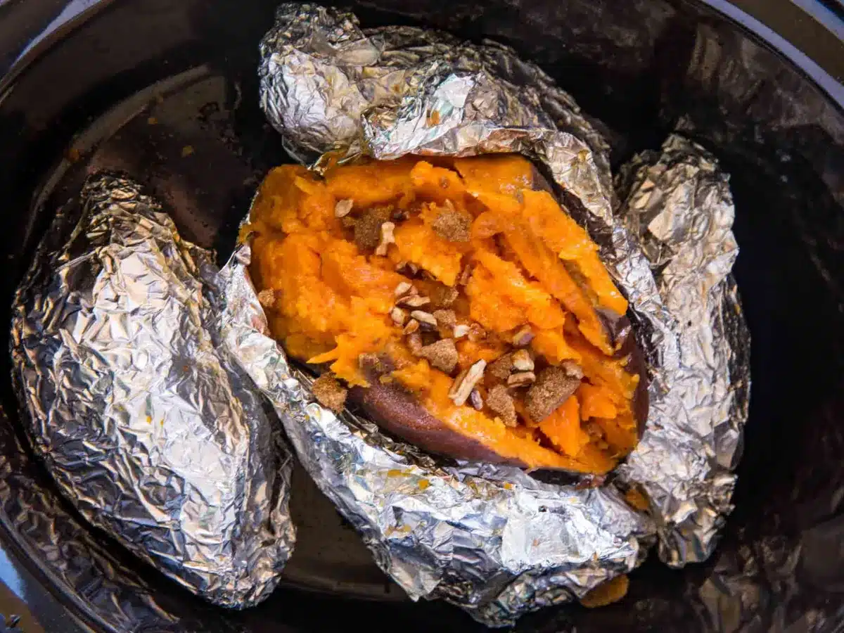 potatoes in slow cooker topped with nuts