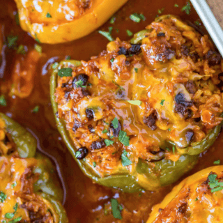beefy, cheesy, spiced veggie boats in a baking pan