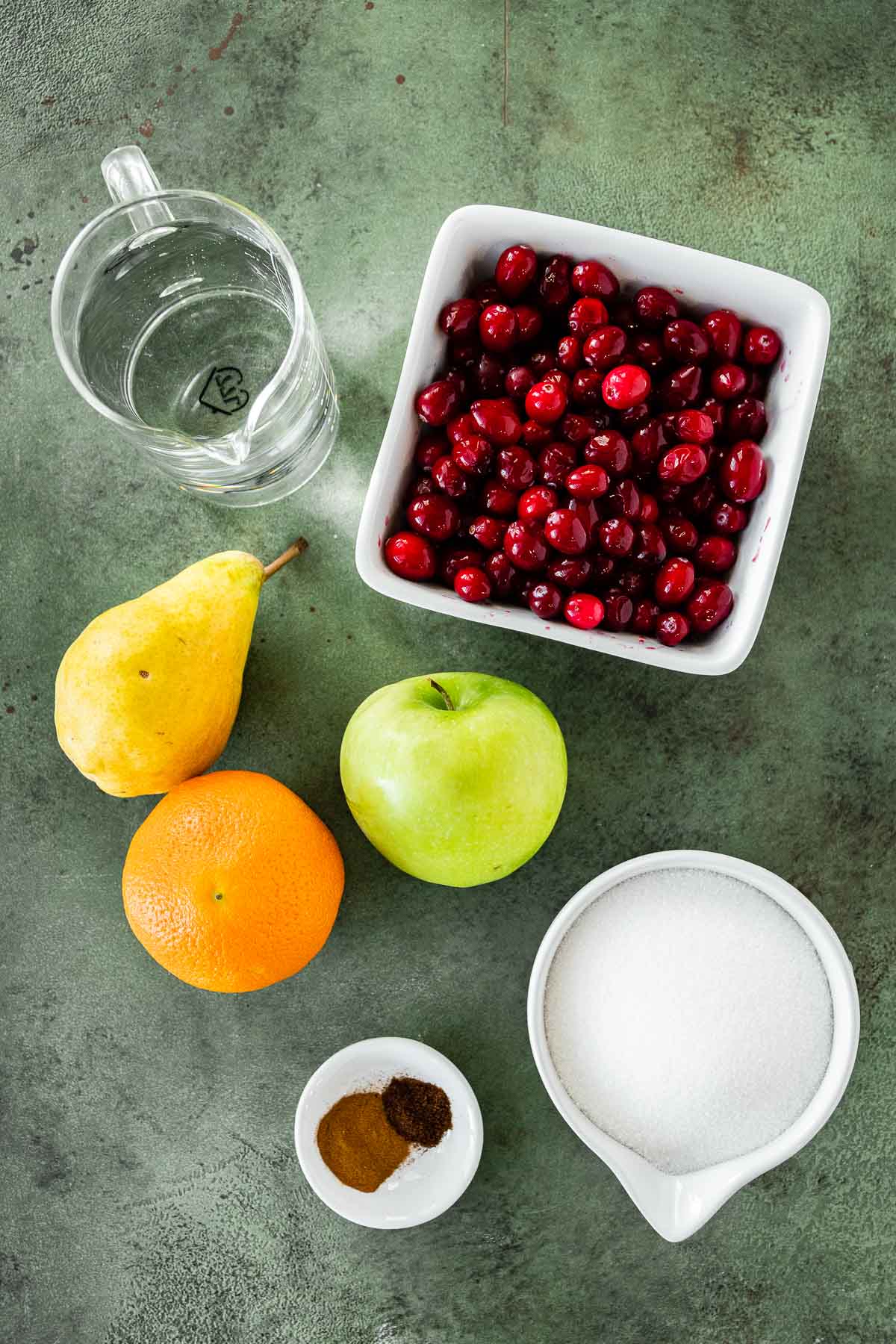 Ultimate Cranberry Sauce ingredients spread out in prep bowls