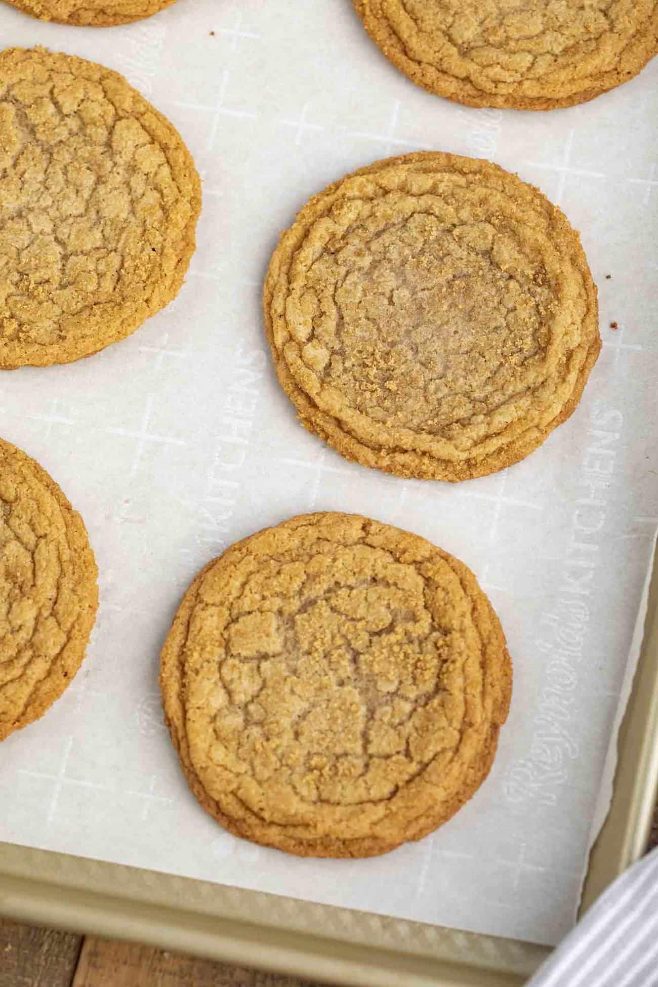 Brown Sugar Cookies made with dark brown sugar and butter are sweet, soft, chewy, and the PERFECT spin on the traditional cookie ready in under 30 minutes! A perfect dessert for holiday parties or for a Christmas cookie swap! Baked cookies on a baking sheet