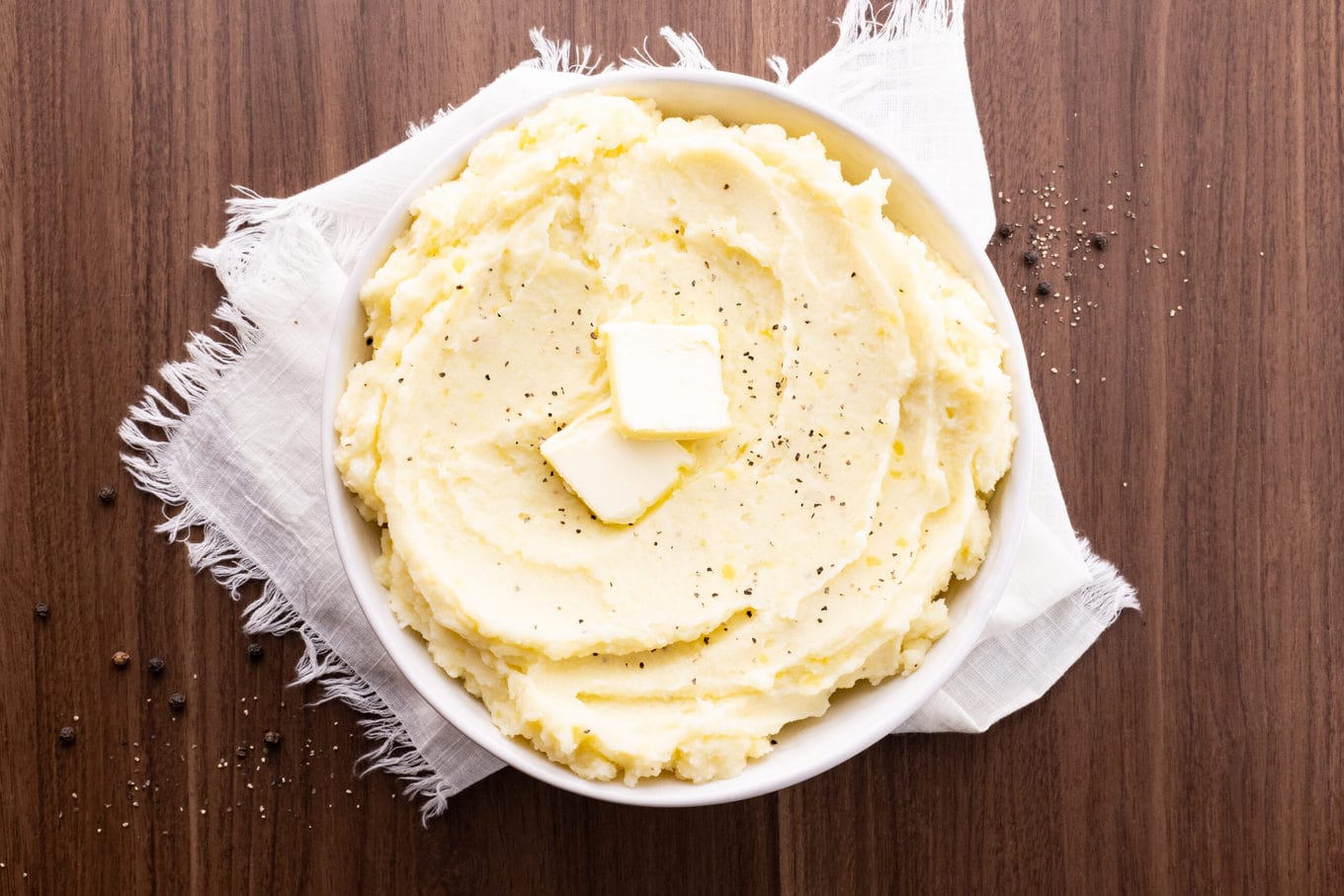 Easy Mashed Potatoes in bowl with butter and pepper