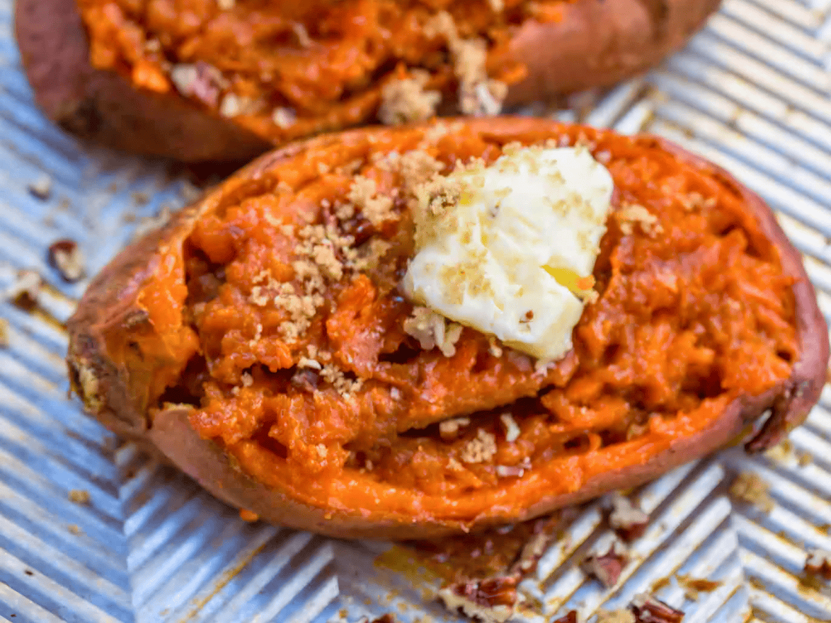 close up of a sweet orange potato on a baking sheet