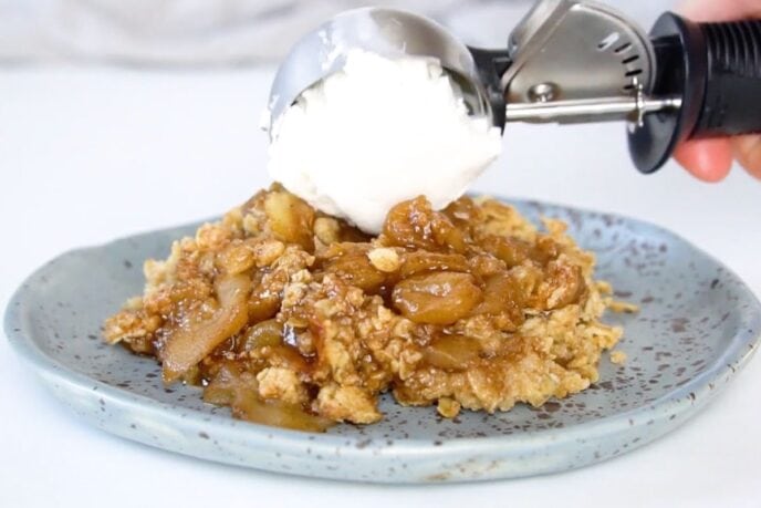 Ultimate Apple Crisp on plate with ice cream