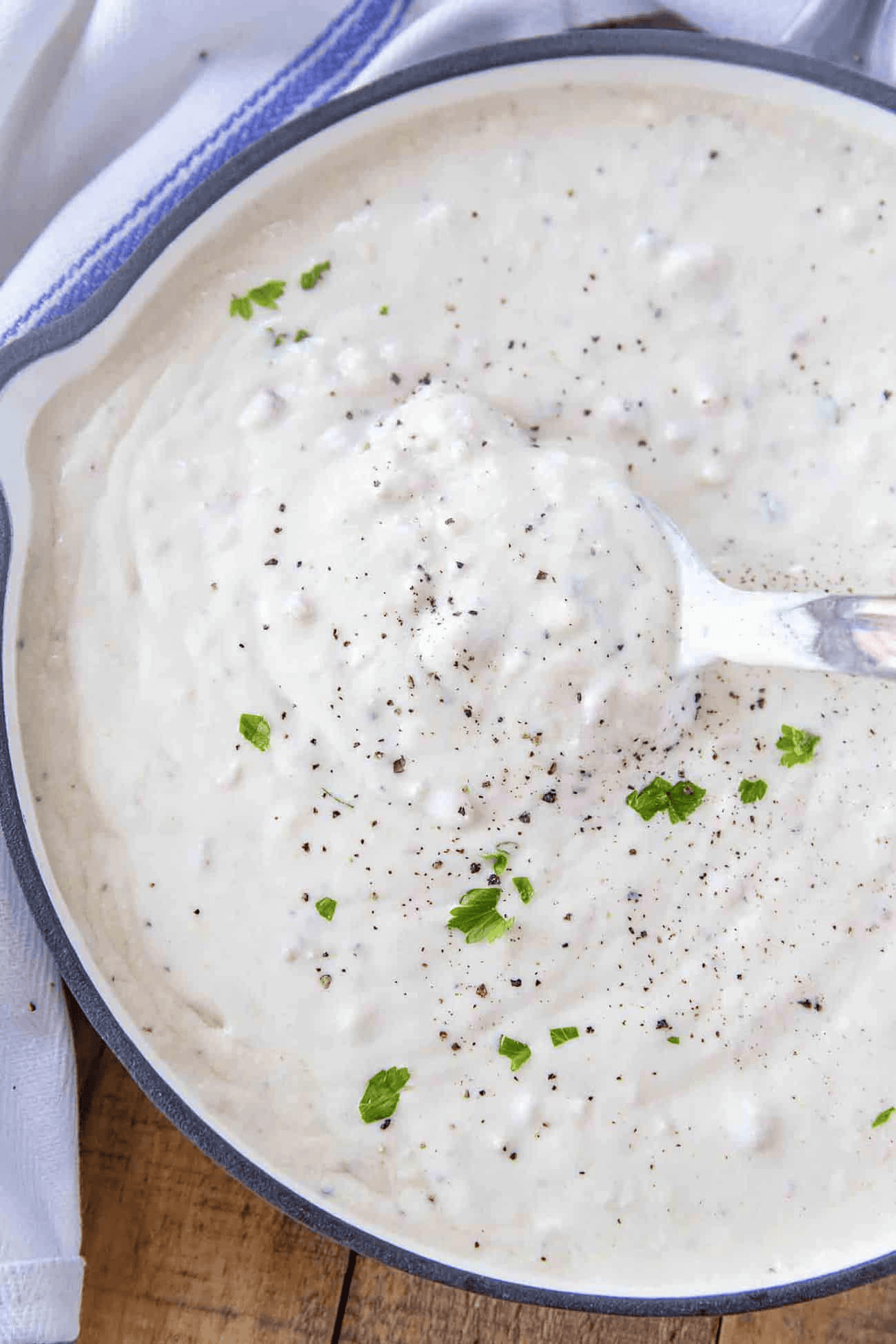 Pan of gravy being scooped