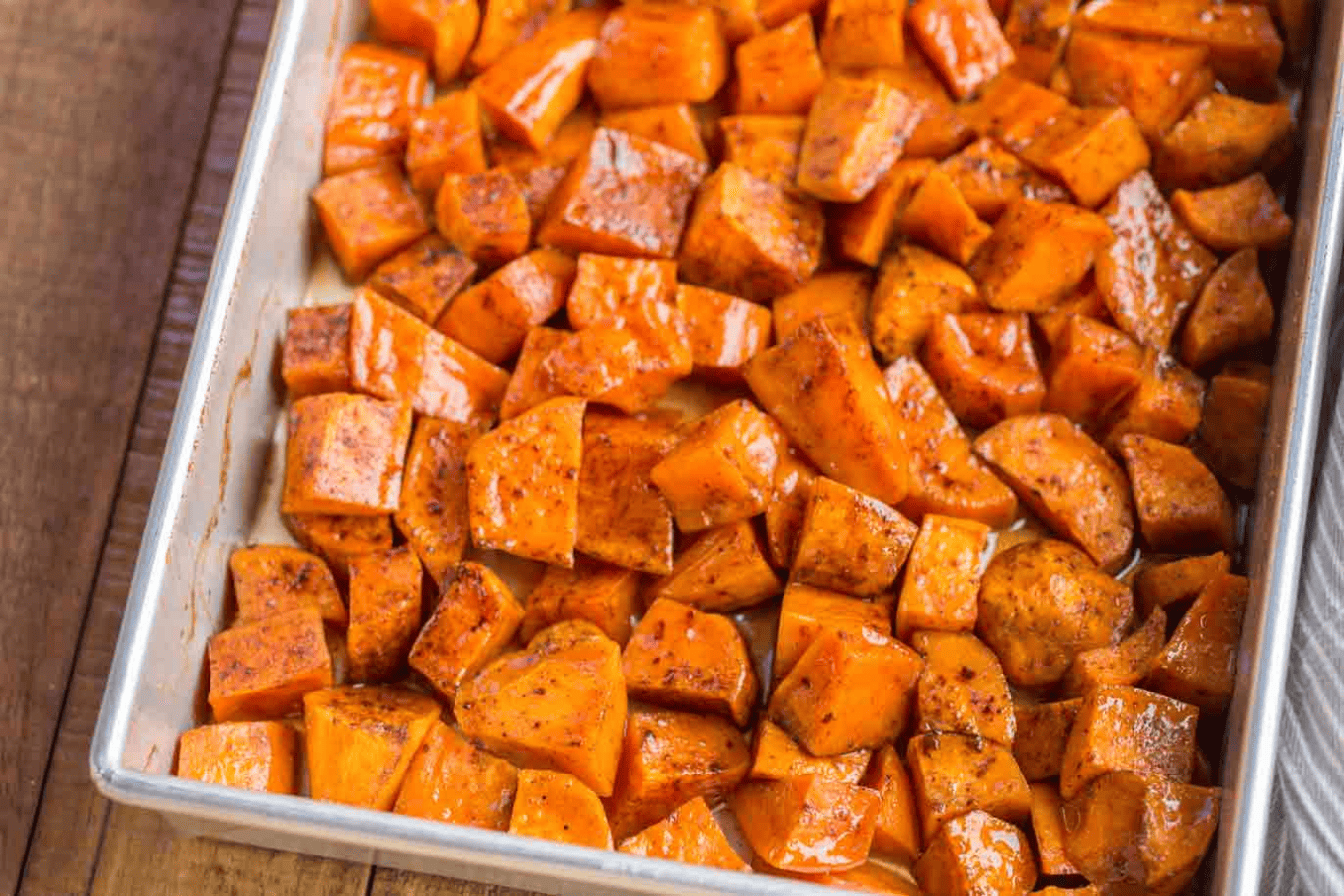 Sliced and roasted yams in a baking dish