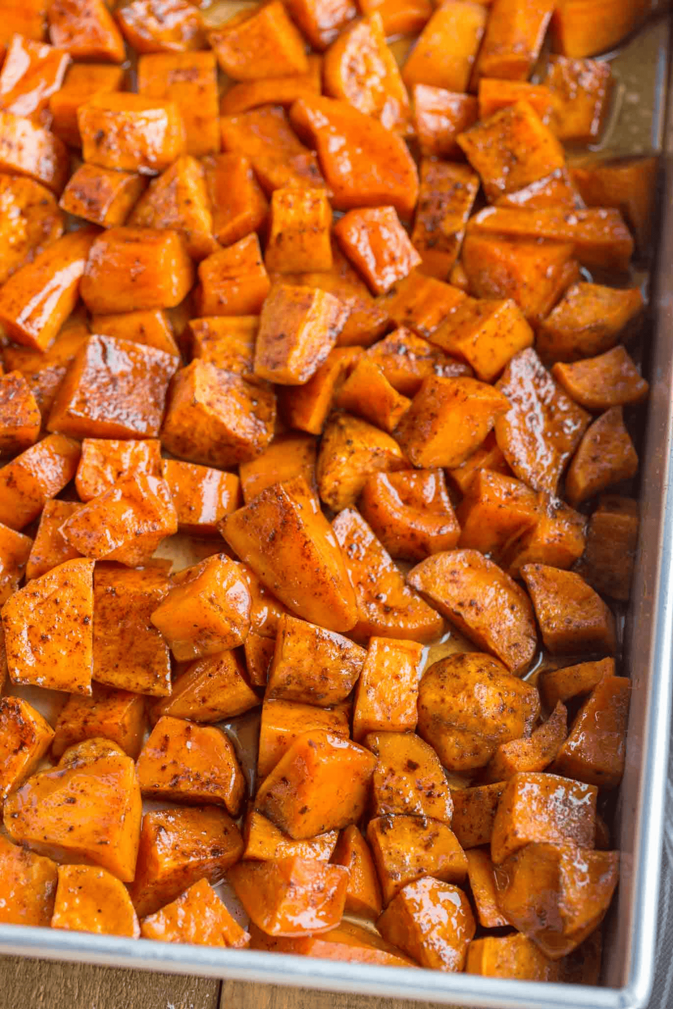 Cross-section of baking pan with candied sweet potatoes
