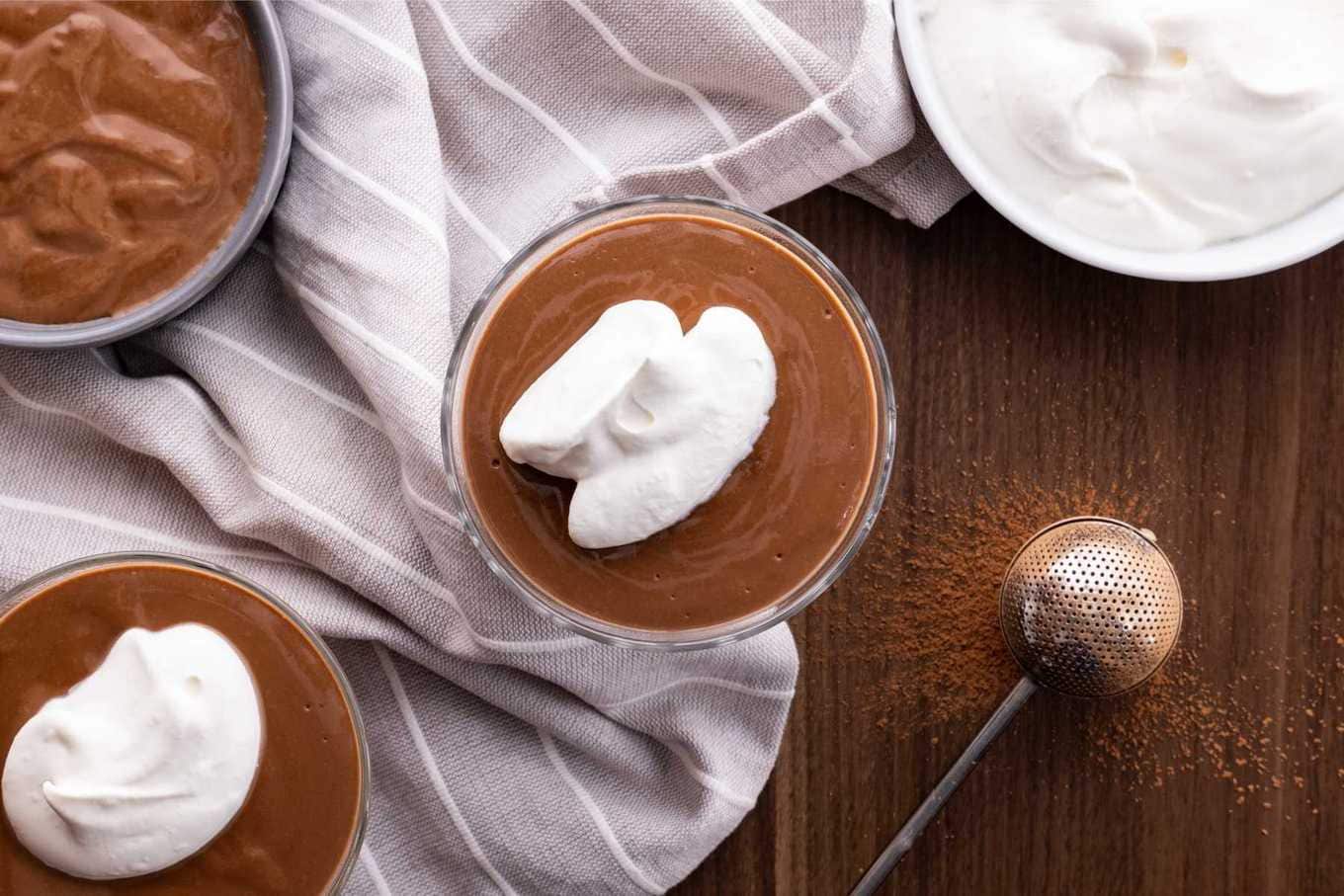 Chocolate Pudding in dessert dish with whipped cream