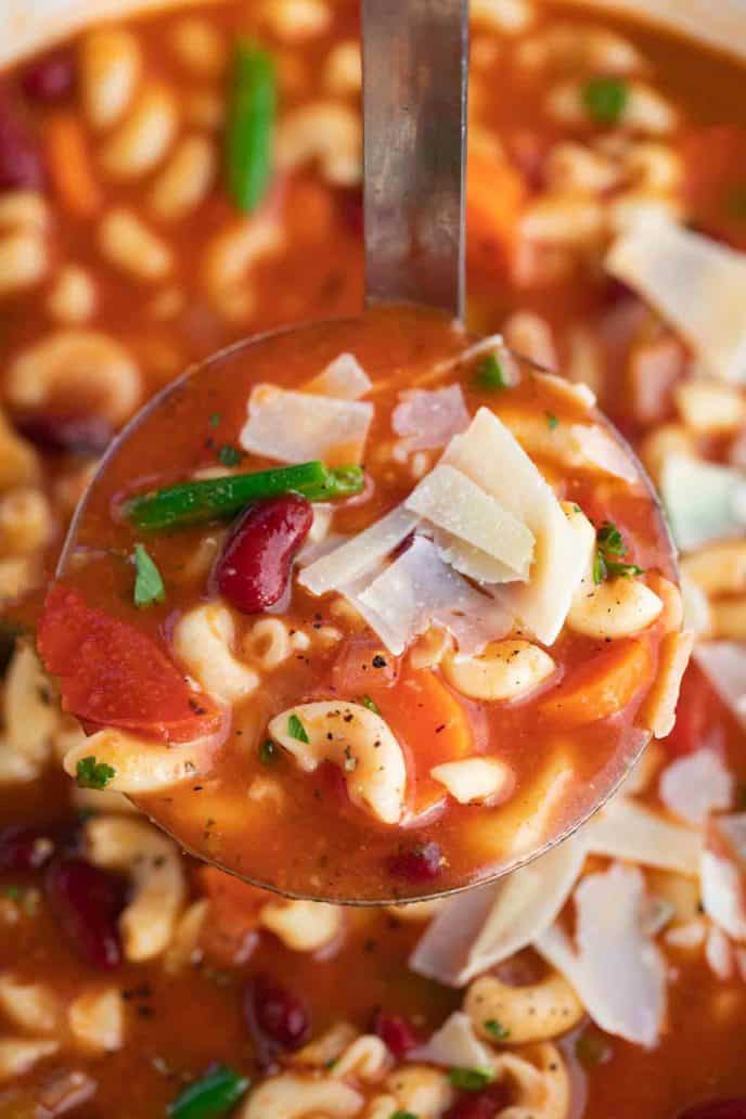 close up of ladle of soup 