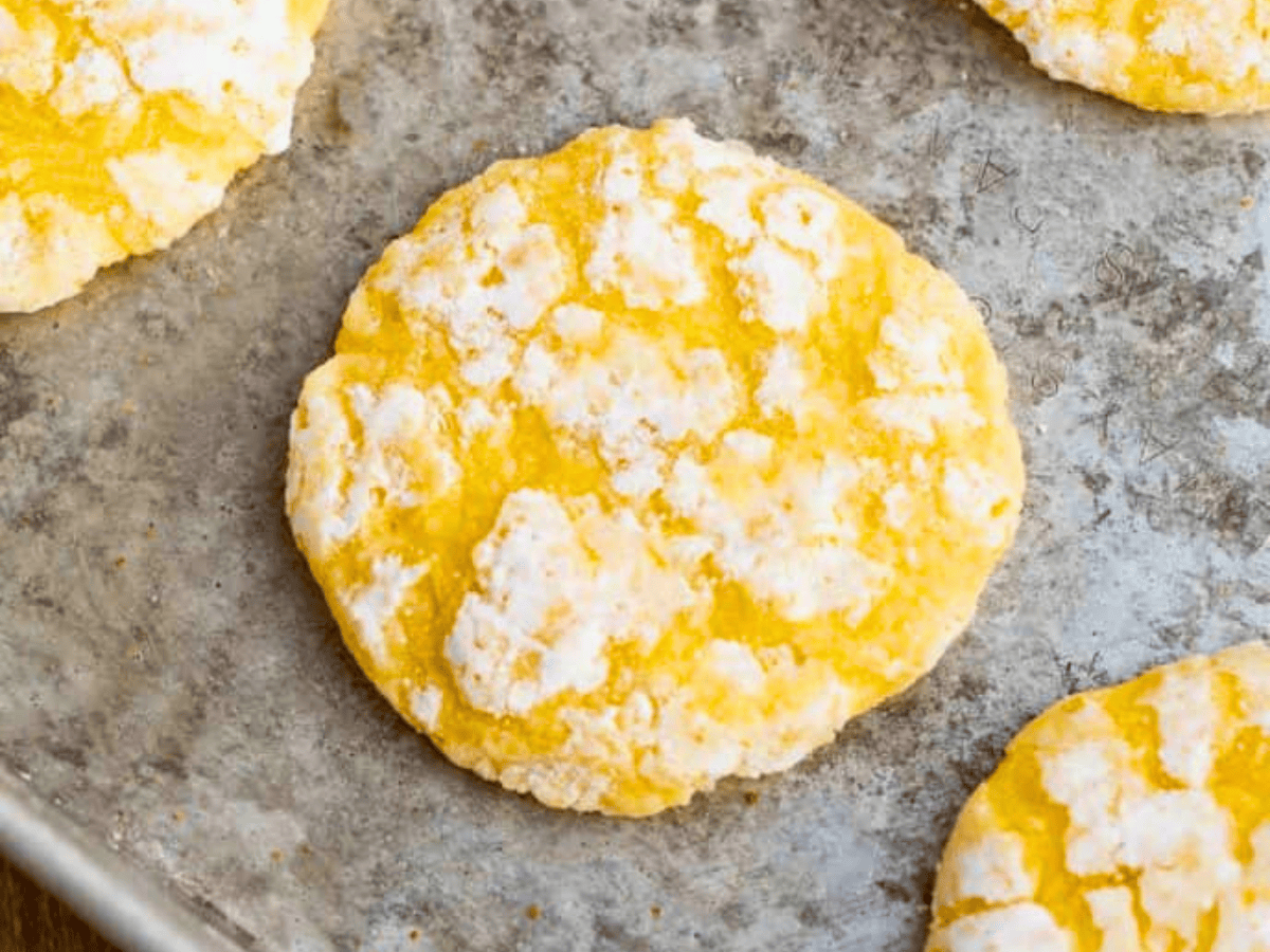Close up of yellow cookie with powdered sugar