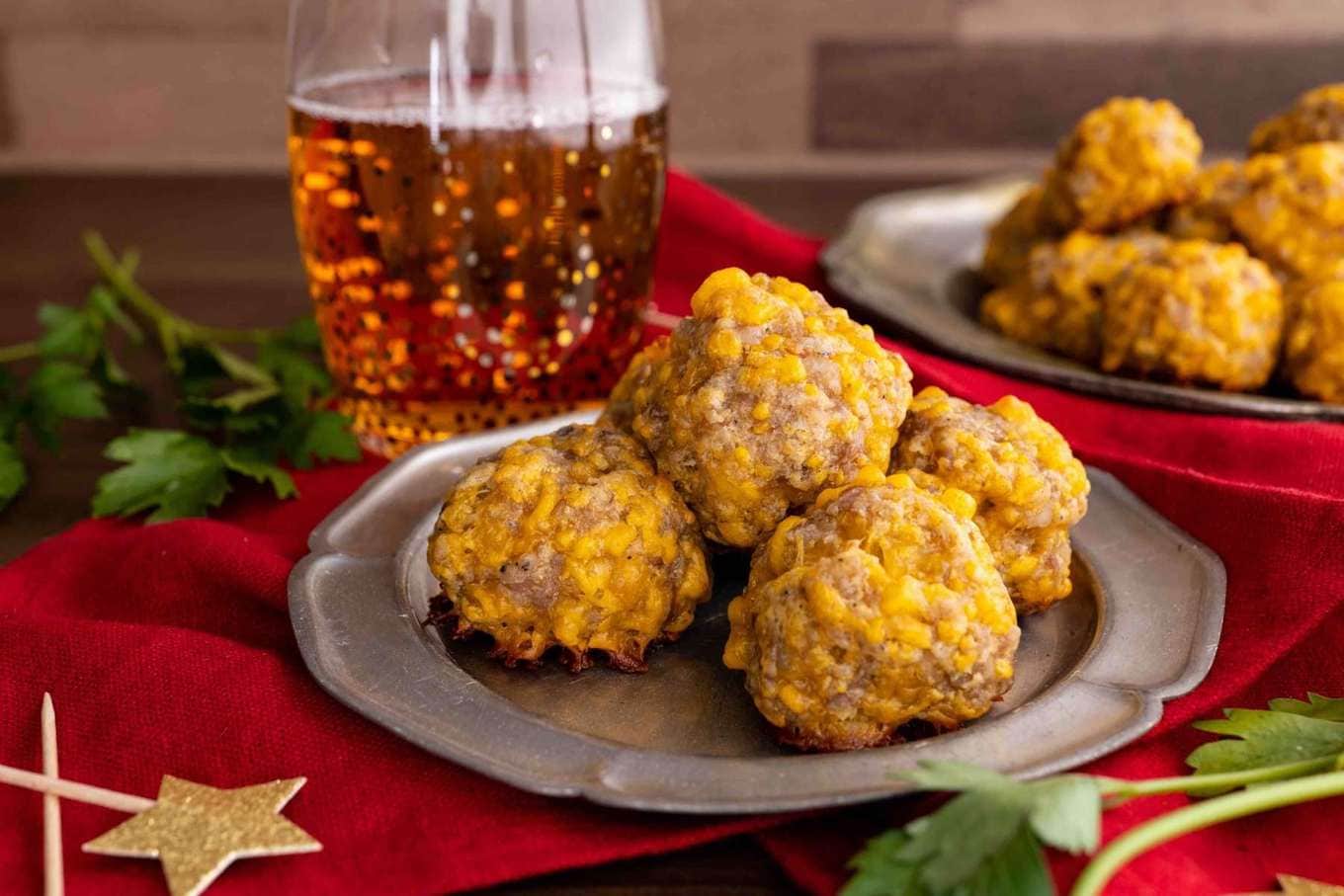 Sausage Balls on serving plate with drink.