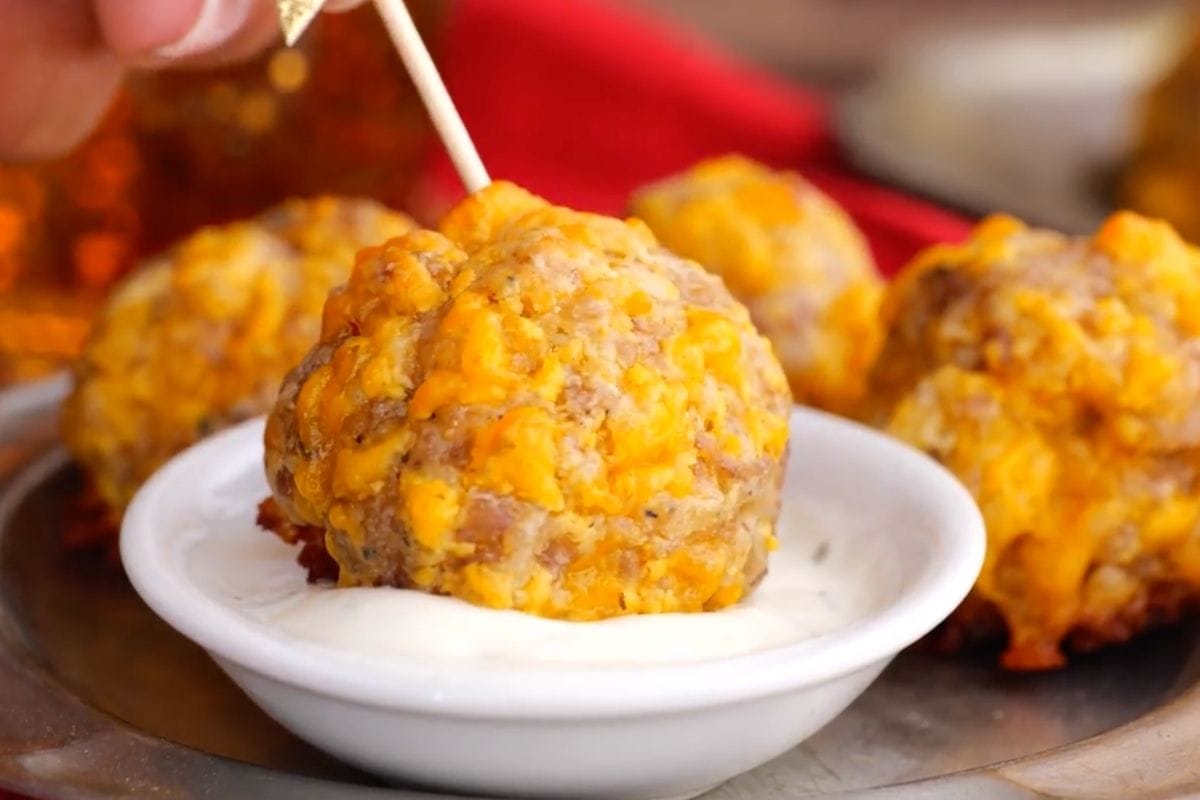 Sausage Balls on toothpick dipped in Ranch dressing