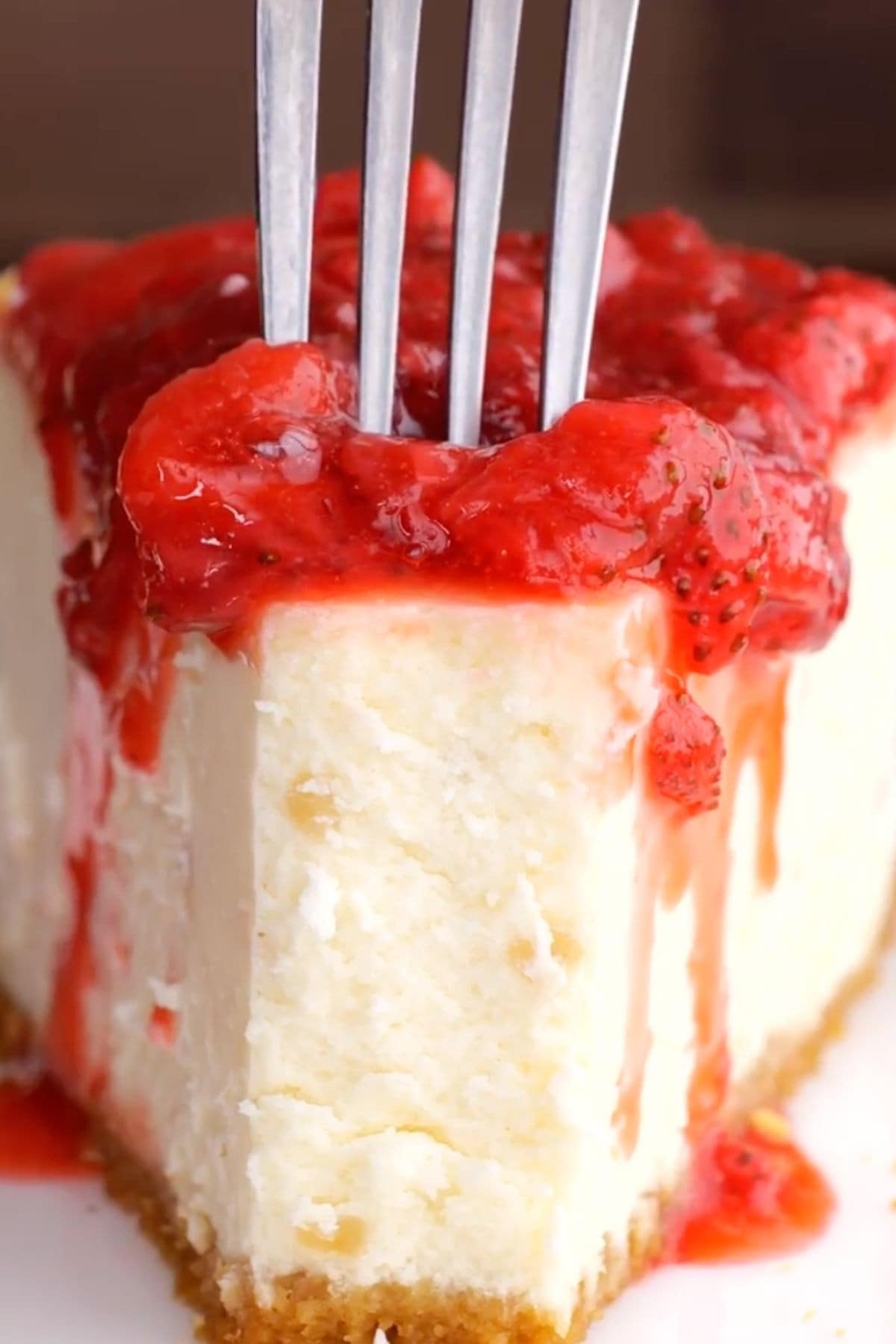 Strawberry Topping on slice of cheesecake with fork