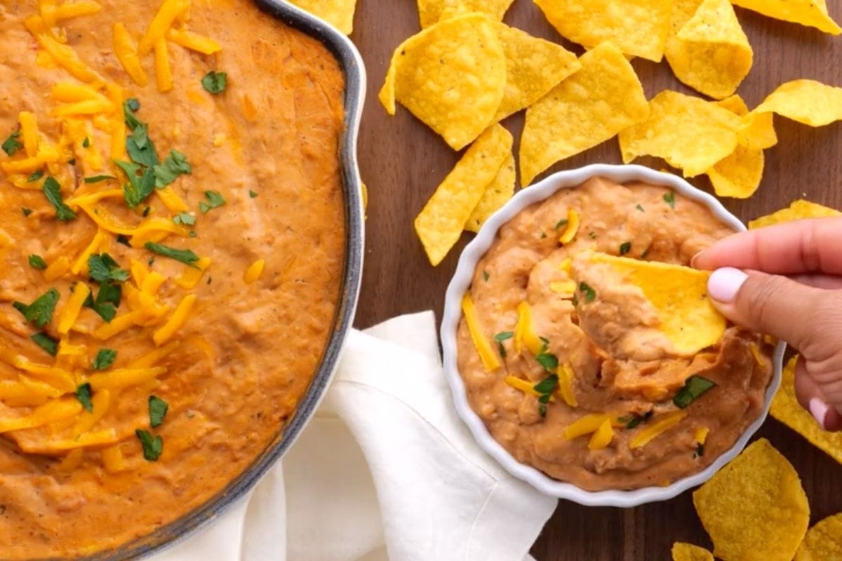 Ultimate Bean Dip in serving bowl with chips