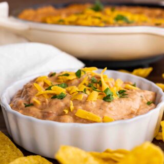 Ultimate Bean Dip in serving bowl with chips