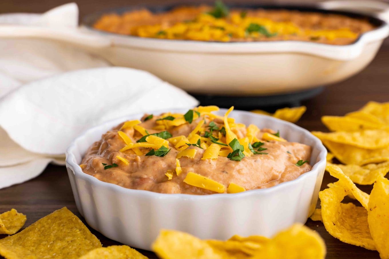 Ultimate Bean Dip in serving bowl with chips