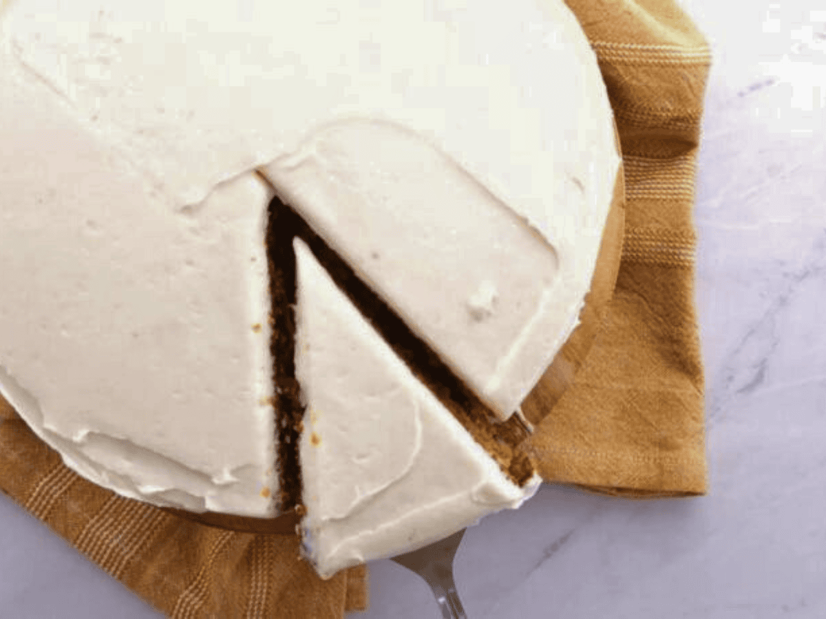 Cake with white frosting with slice taken out