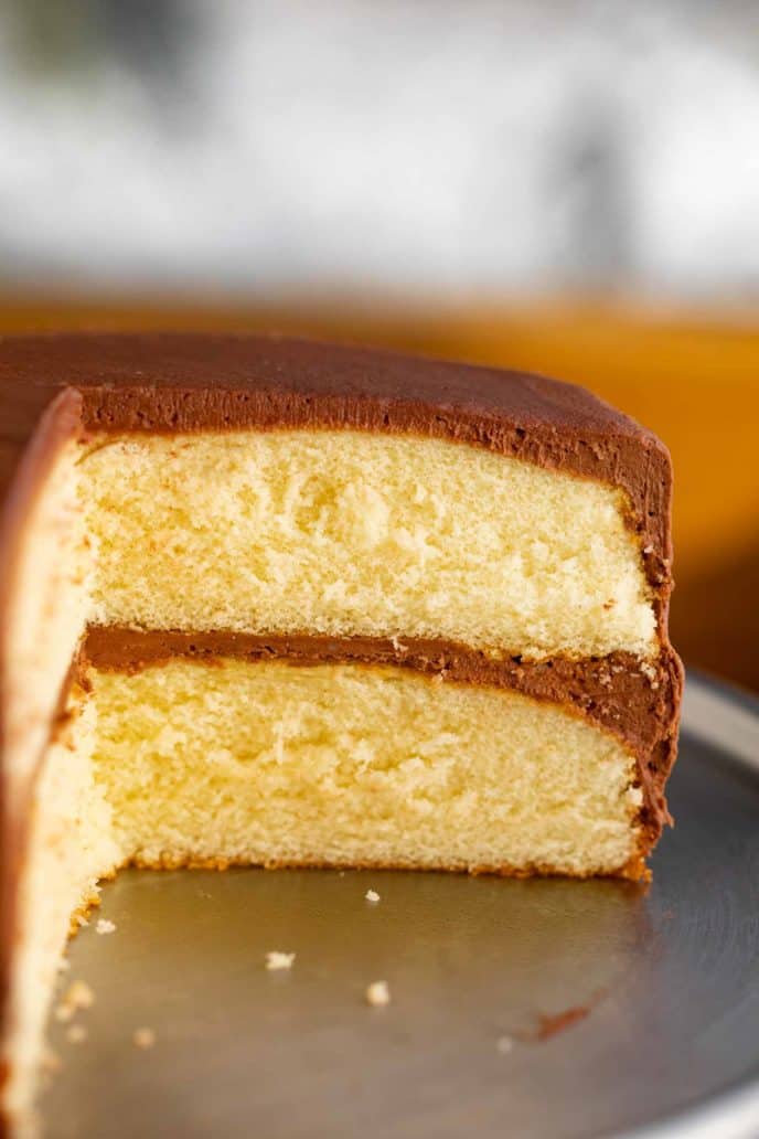 Classic Yellow Cake sliced open on cake stand