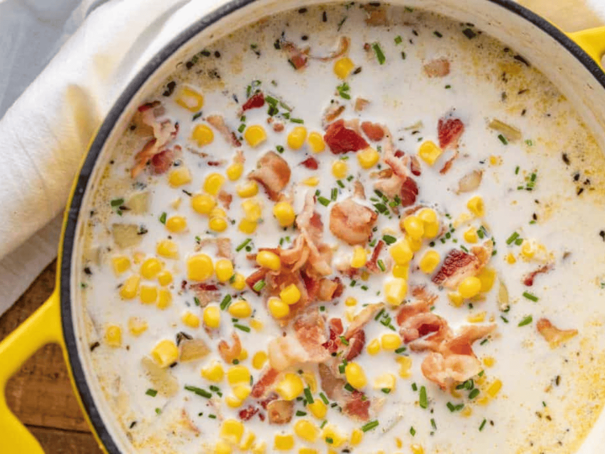 yellow pot full of cream, corn, and potatoes
