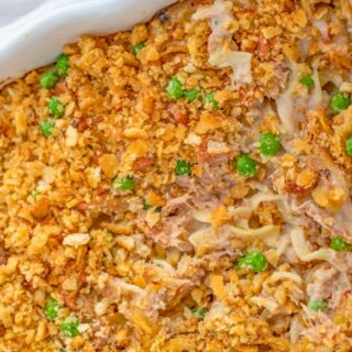 Finished casserole dish with peas and crunchy topping