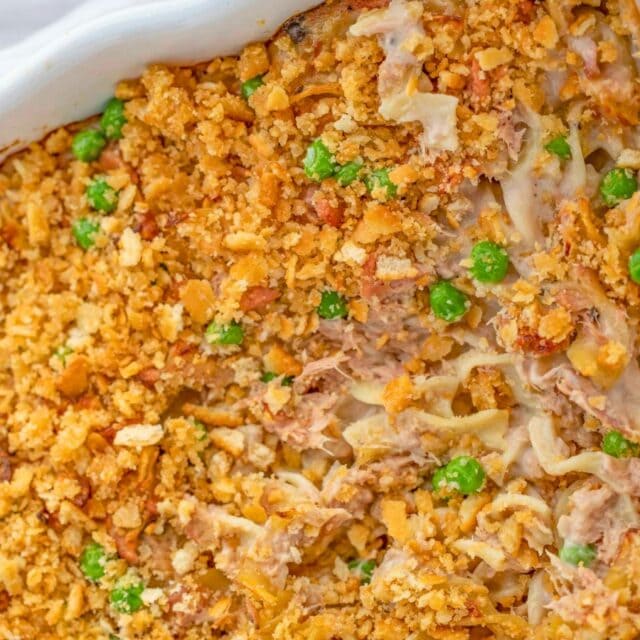Finished casserole dish with peas and crunchy topping