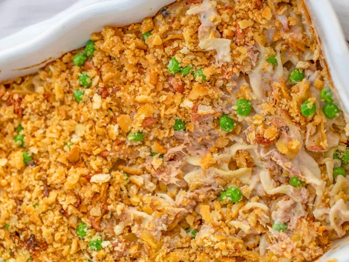 Finished casserole dish with peas and crunchy topping