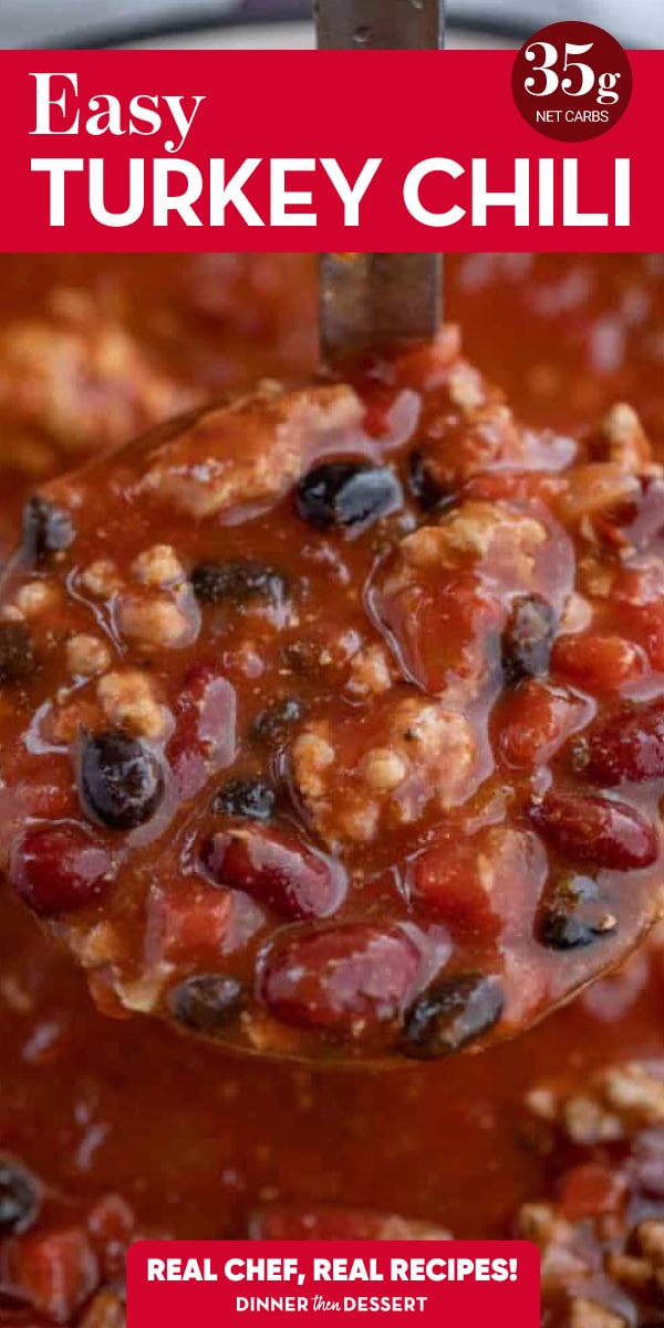 Ladle of red chili with ground turkey meat, black beans and red kidney beans.