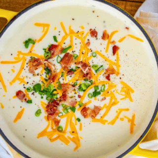 Pot with soup and toppings