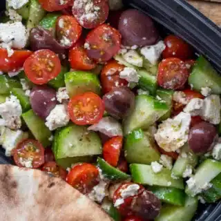 salad with pita bread on the side