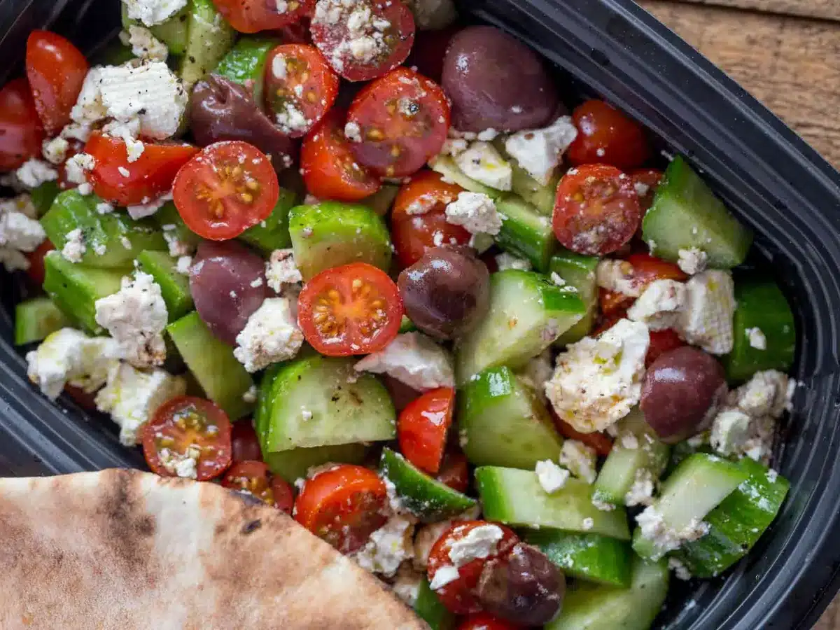 salad with pita bread on the side