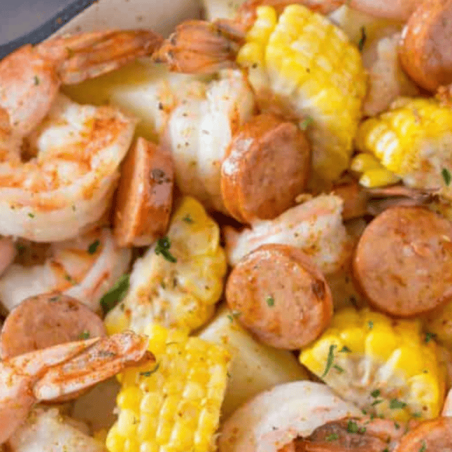 shrimp, potatoes, sausage and corn in a pot
