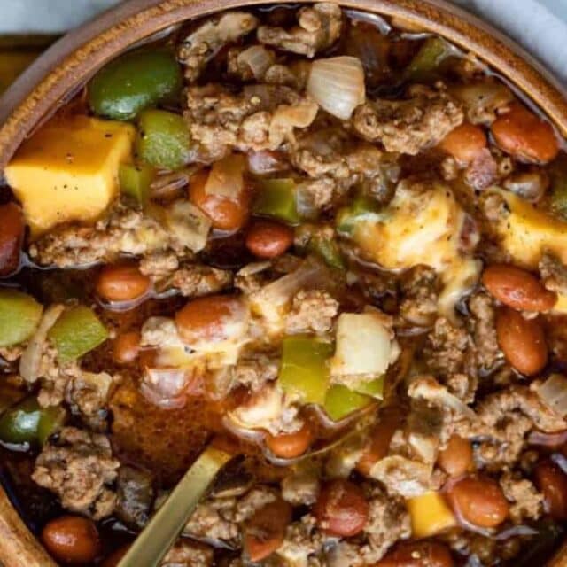 Hearty chili with beef, potatoes, and veggies in bowl.