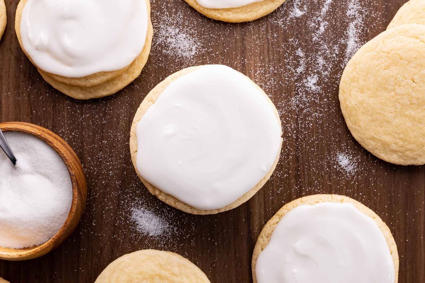 Rolled Sugar Cookies on board with buttercream icing