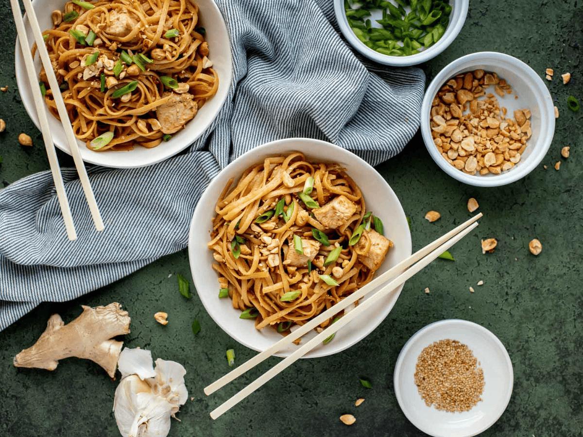 noodles and chicken in bowls