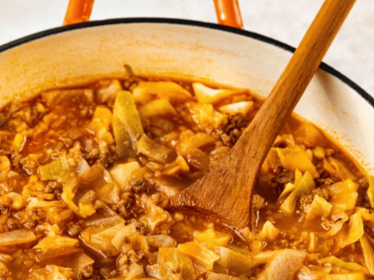 Cabbage in pot with wooden spoon