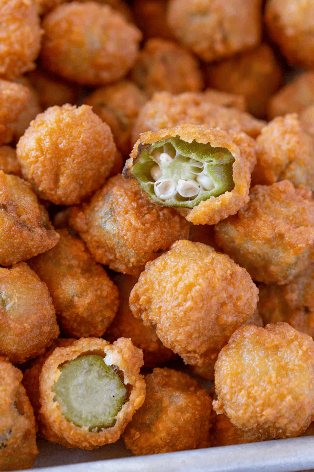 Pile of fried okra with one cut in half