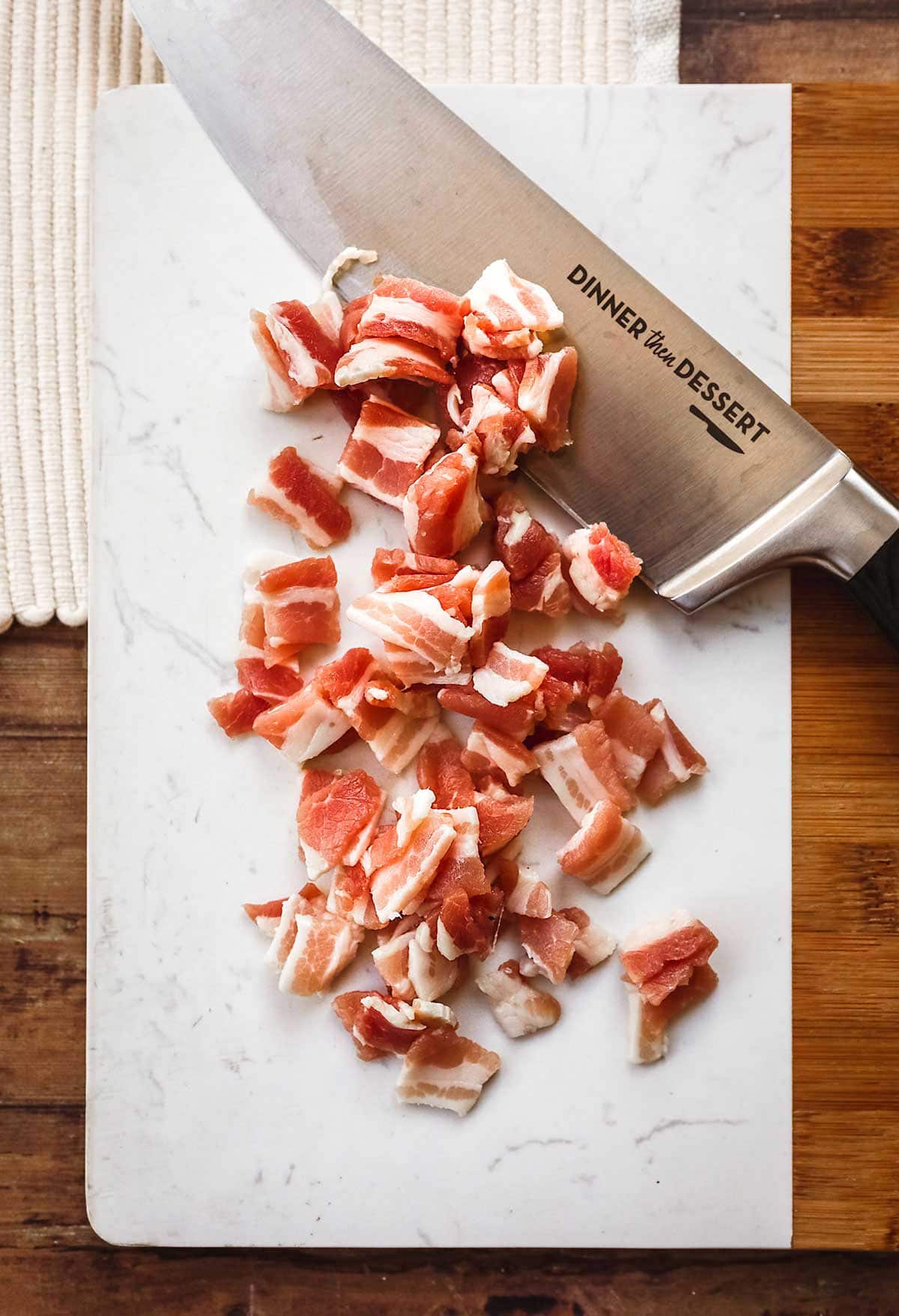 Bacon Carbonara Pasta bacon sliced on cutting board with knife
